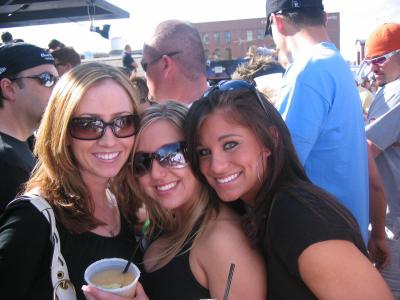 3 ladies, 1 is wearing hoops