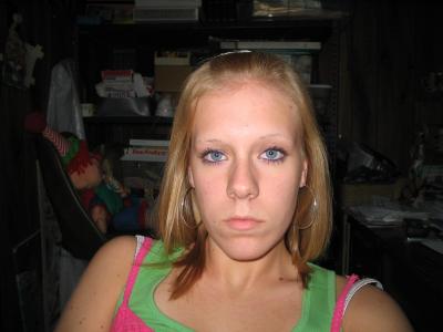 Wearing simply her hoops!