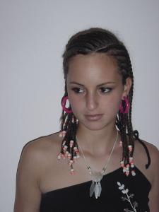 Braid girl is wearing red hoops 